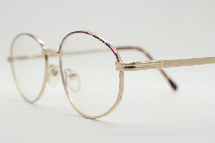 90s vintage oval eye glasses. Bright golden optical frames with coloured enamel brows. Prescription RX spectacles. Clear lens NOS