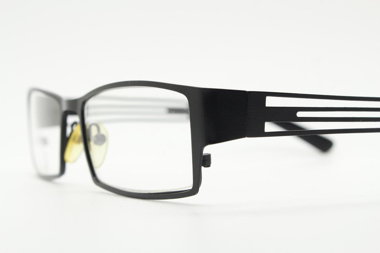 Police 90s vintage rectangular eye glasses model 023. Solid metal optical frame in black satin finish with cut out arm stripes. Prescription