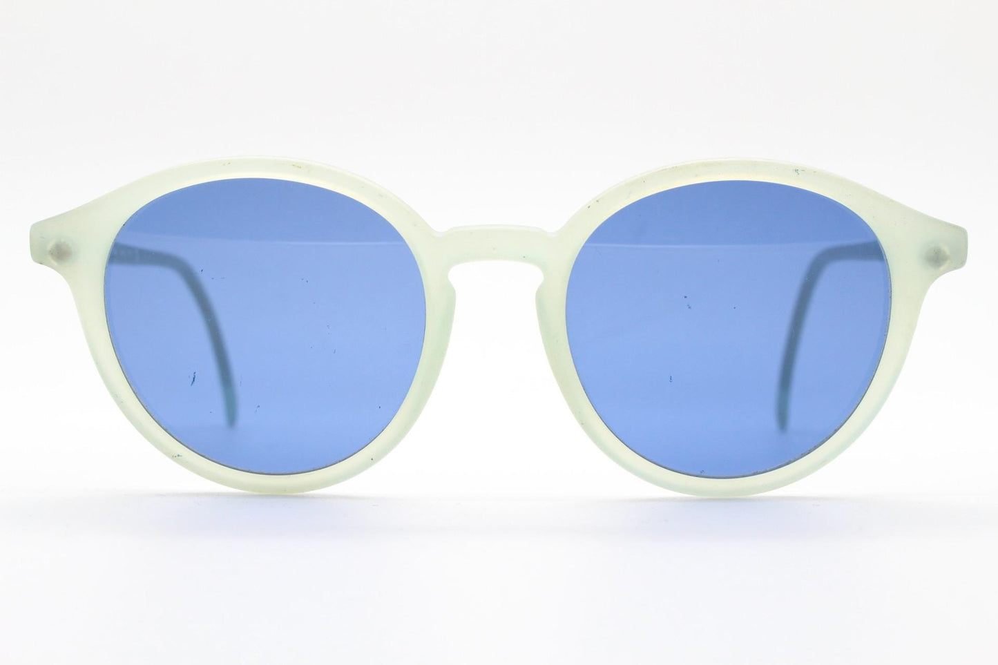 Sergio Tacchini 80s vintage round horn rim sunglasses made in Italy. Transparent pale blue frosted acetate frame with navy lenses. NOS