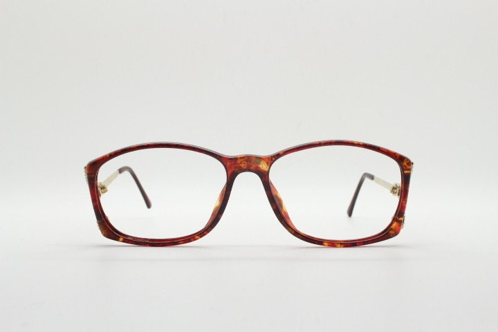 Christian Dior 80s vintage rectangular eye glasses made in Germany from Optyl. Striking marbled amber acetate optical frame. Prescription RX