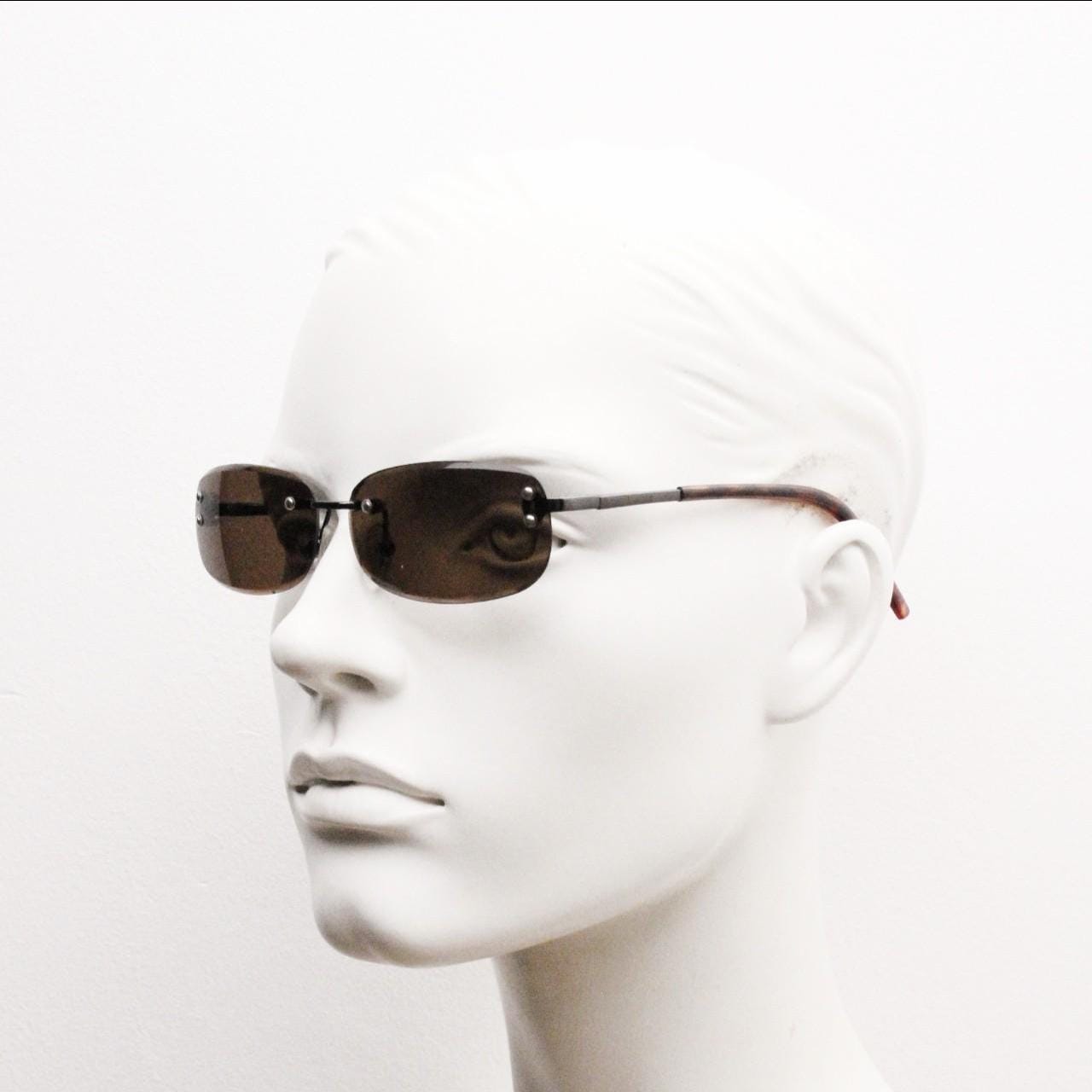 90s vintage minimal frameless sunglasses. Minimal brown rectangular lens with bevelled edges, gunmetal grey trim and tortoise arms. NOS