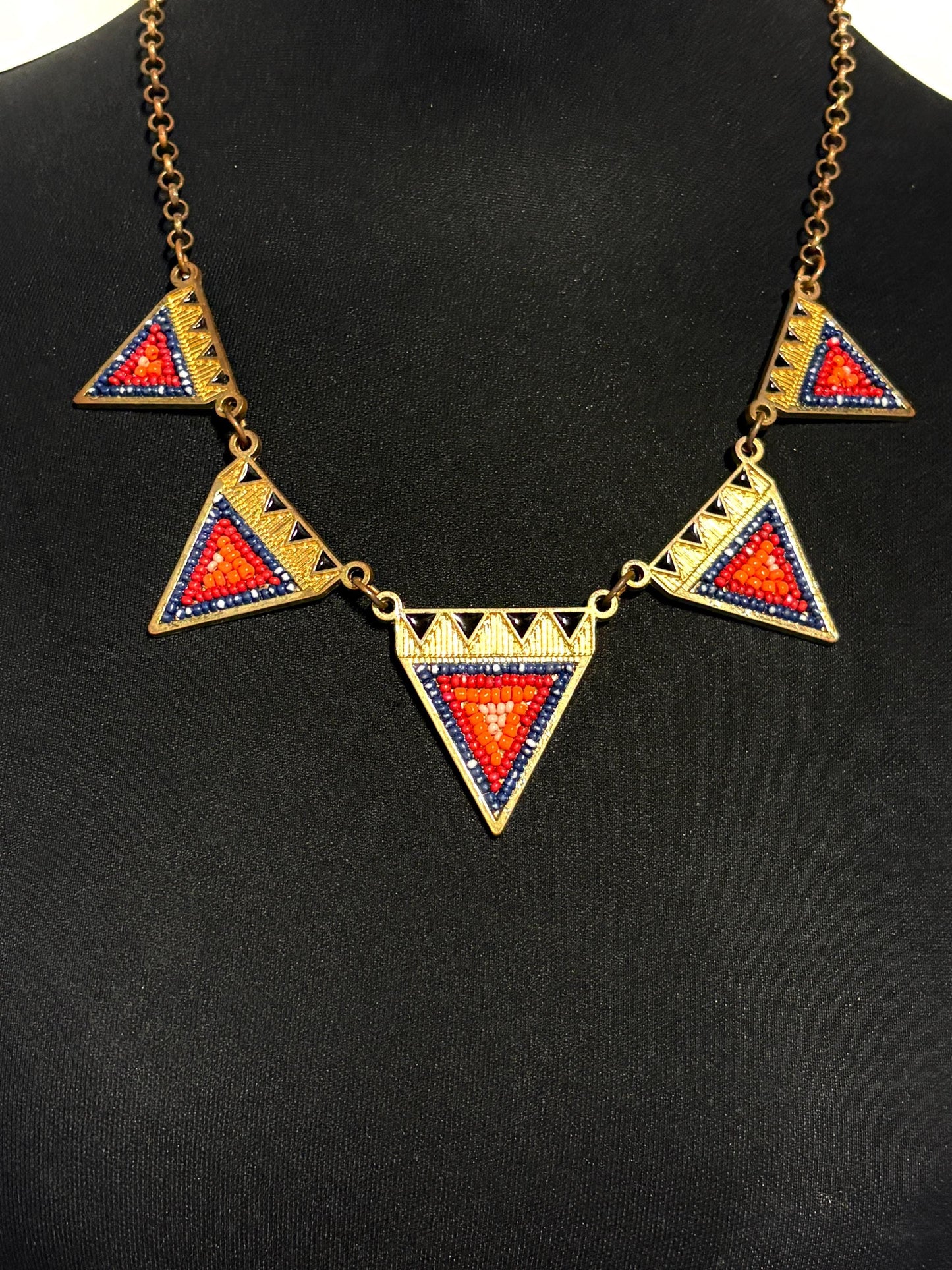 80s vintage gold triangles necklace. Aztec style with multi coloured bead inlays and ornate patterns. Womens statement design