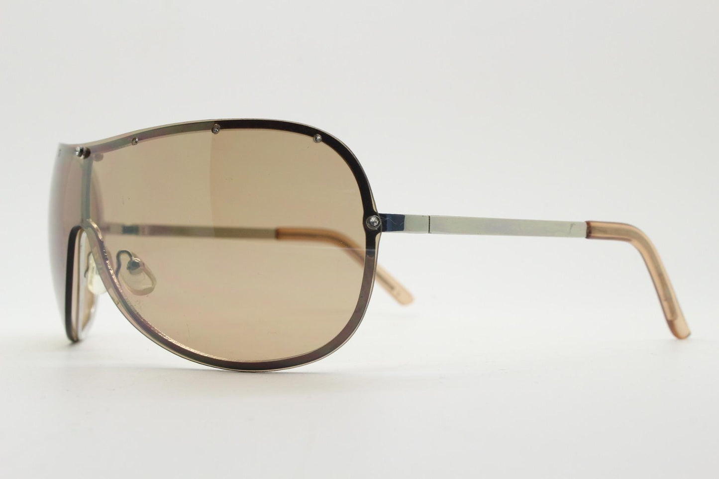 Y2K vintage visor aviator sunglasses with diamante. Brown wrap around mini mask shield design with curved mono lens. 2000s. Racing style