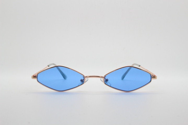 90s vintage small diamond sunglasses. Minimal gold psychedelic mod style frame with sky blue lenses. Unused New Old Stock