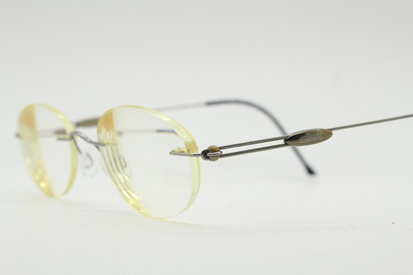 Silhouette vintage oval frameless eye glasses made in Austria. Minimal lightweight brown chrome optical frame. Prescription spectacles