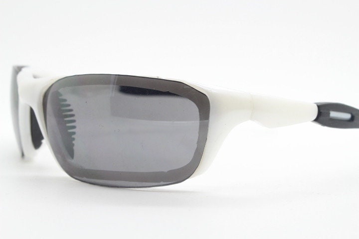 Y2K vintage visor sunglasses. Black and white superhero style sport shield with curved black lenses. Aerodynamic wrap around. NOS rave
