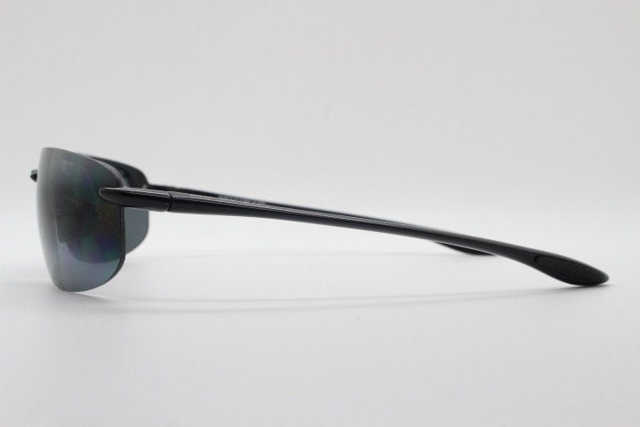 Maui Jim sport wrap around sunglasses made in Japan. Lightweight half frame shield with curving lenses. 2000's. Y2K