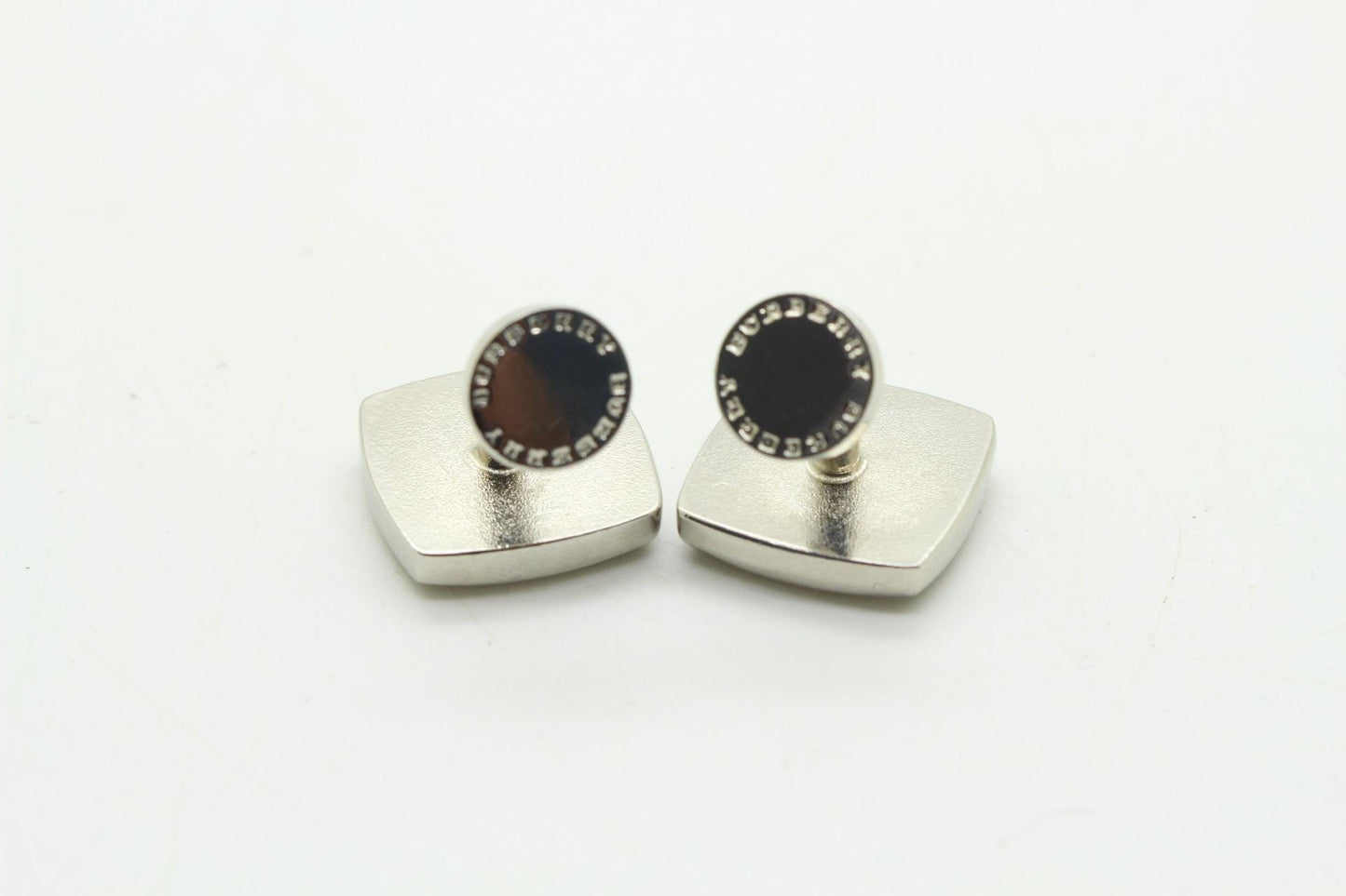 Burberry vintage square cuff links made in England. Solid metal with red enamel. Signature check on one side, plain on the other. NOS
