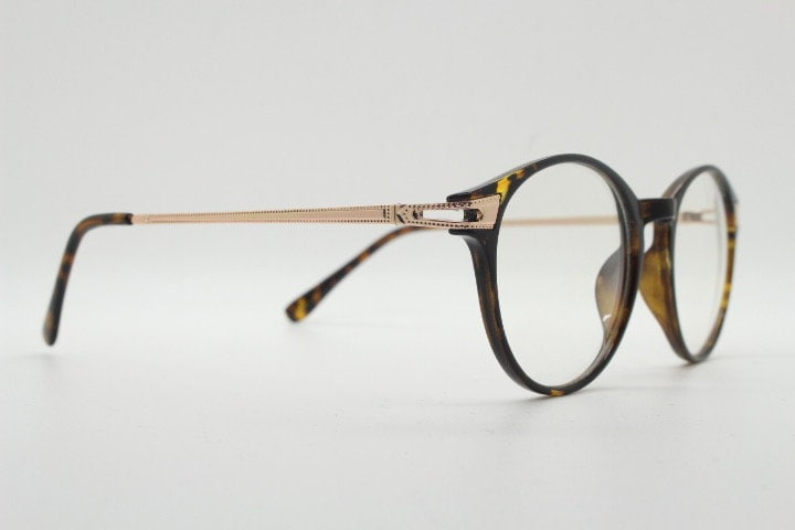 90s vintage round glasses with tortoise front and gold embossed arms. 40s, 50s style prescription optical frames. Clear lens eyeglasses. RX