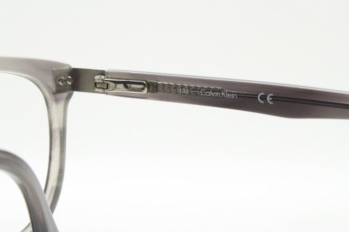 Calvin Klein rectangular eye glasses. Unisex transparent grey gloss acetate optical frames. Prescription eyeglasses. RX spectacles