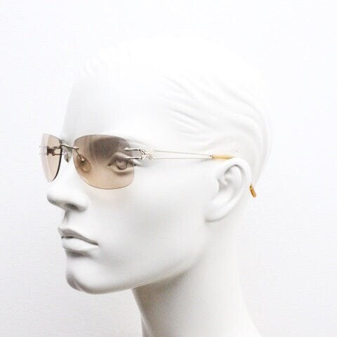 Y2K vintage rimless rectangular sunglasses. Frameless 2000's brown lens with slight mirror glaze gold trim and butterfly hinges. 00's NOS