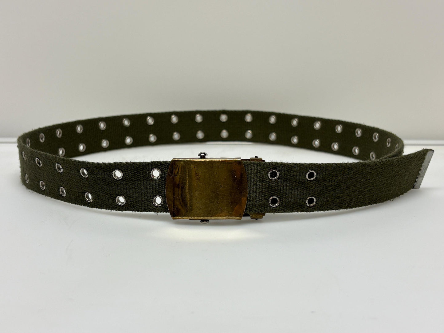 90s vintage canvas army style belt. Khaki green with 2 rows of silver metal holes. Slide lock gold buckle. Webbing. Fully adjustable