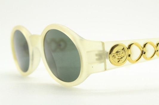 Vintage 90s oval transparent sunglasses. Frosted frame with dark green lenses and heart shaped chain link arms. Unworn NOS