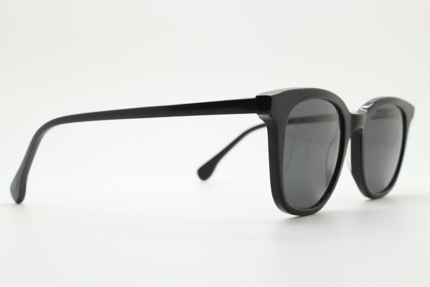 Vintage 90s slim frame black horn rim sunglasses. All time classic retro refined wayfarer design in gloss with black lenses