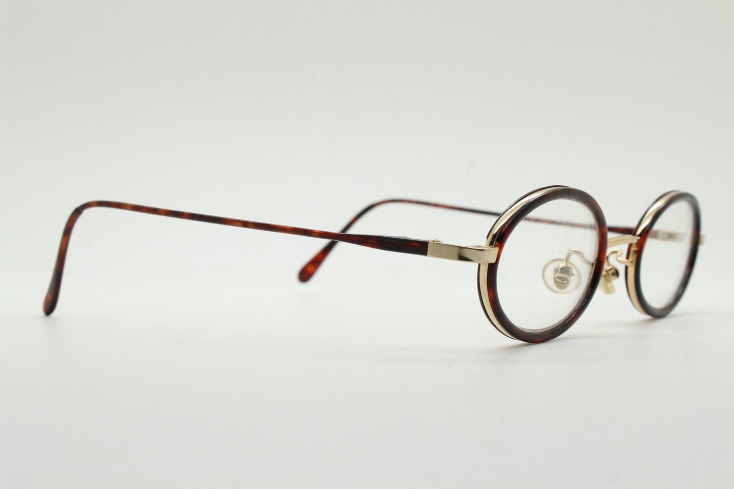 90s vintage small oval eye glasses. Gold metal frame 20s design optical frames with tortoise inserts and arms. Prescription. Spectacles NOS
