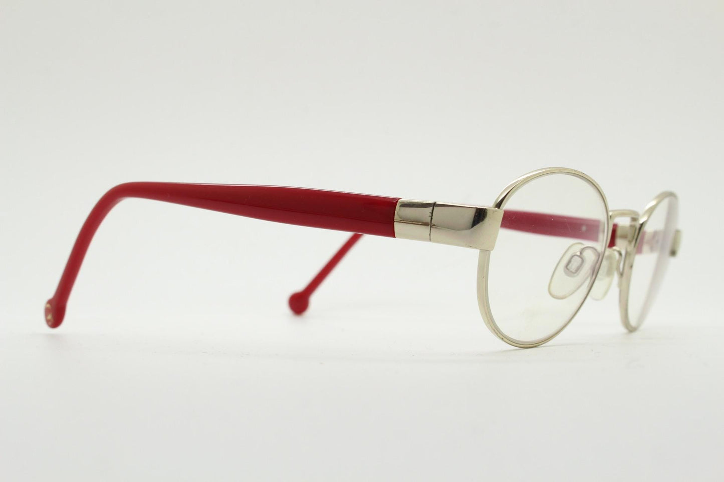 Red or Dead Y2K vintage oval eye glasses. Green or red interchangeable arms on a chrome metal frame. Optical prescription eyeglasses. RX