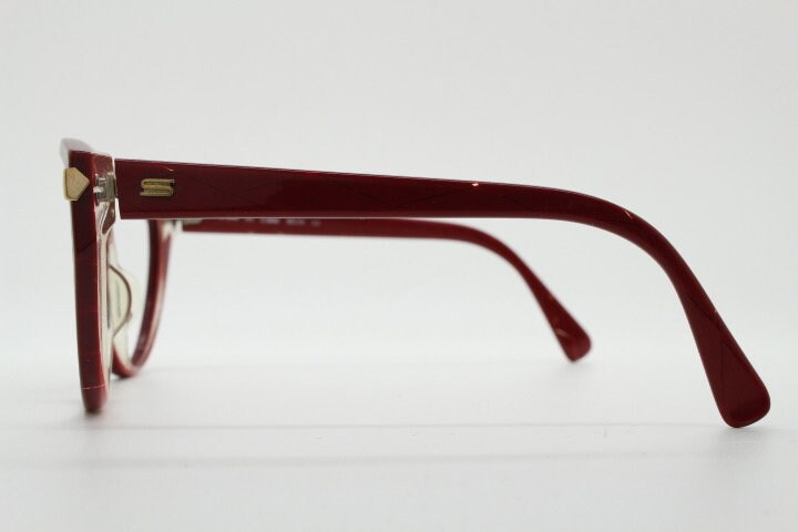 Silhouette 80s vintage oversized cat eye glasses made in Austria. Dramatic red prescription optical frame with subtle criss cross stripes RX