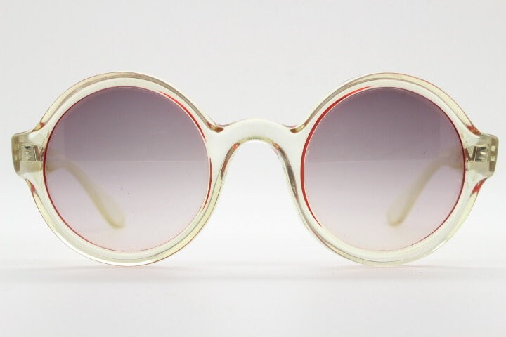Mary Quant 60s vintage round sunglasses made in France. Yellow crystal transparent lucite frame in with contrasting dark graduating lenses