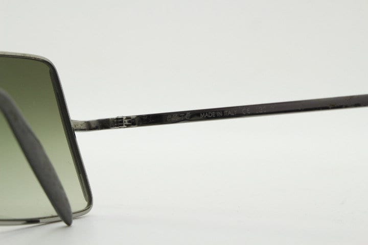 Exte rectangular 90s vintage sunglasses made in Italy. Grey chrome low profile frame with graduating green lenses