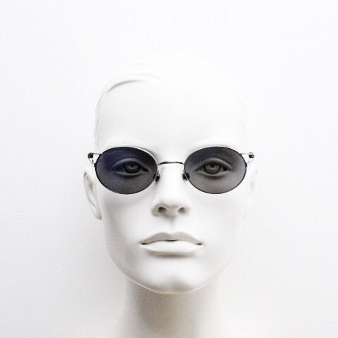90s vintage oval sunglasses. Refined 'industrial tech' style brushed bronze metal frame with cool blue mirror lenses. Unused NOS