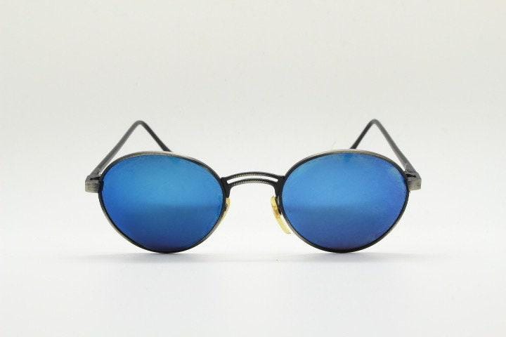 90s vintage oval panto sunglasses. Brushed bronze metal frame with cool blue mirror lenses and black slender arms. Unused NOS