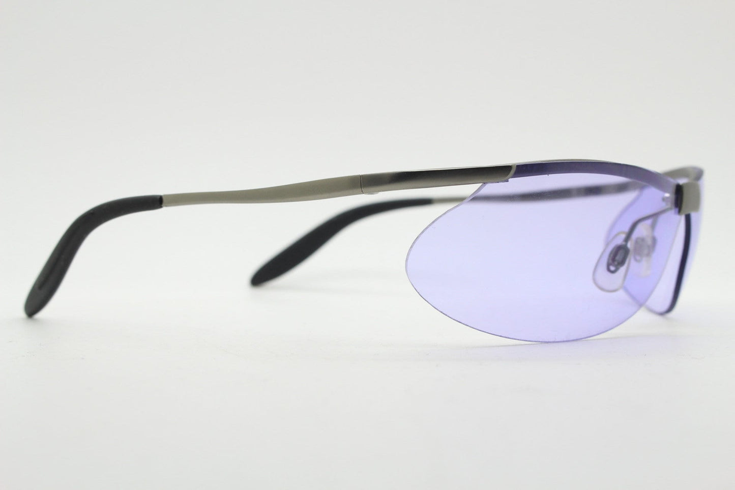 Y2K vintage sport shield sunglasses. 2000's half frame wraparound aerodynamic mini mask visor with purple bug eye lenses. 90s 00s unused NOS