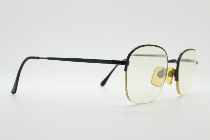 Giorgio Armani round eye glasses made in Italy. Minimal black satin finish half frame spectacles. Prescription optical eyeglasses. RX