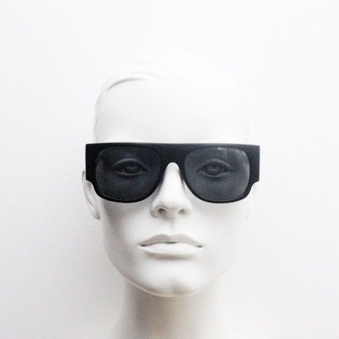 Y2K vintage rectangular side panel sunglasses. Black matt frame with grey lenses and side window spoilers / blinkers. 2000s NOS goggle