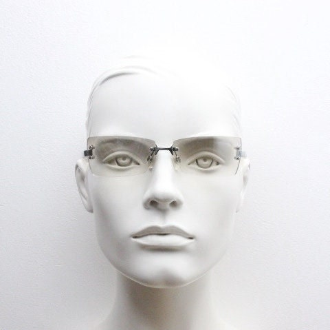Y2K vintage  frameless sunglasses. Minimal light tone curved mirrored lenses with white frosted arms. 2000's. 90s. 00s. NOS