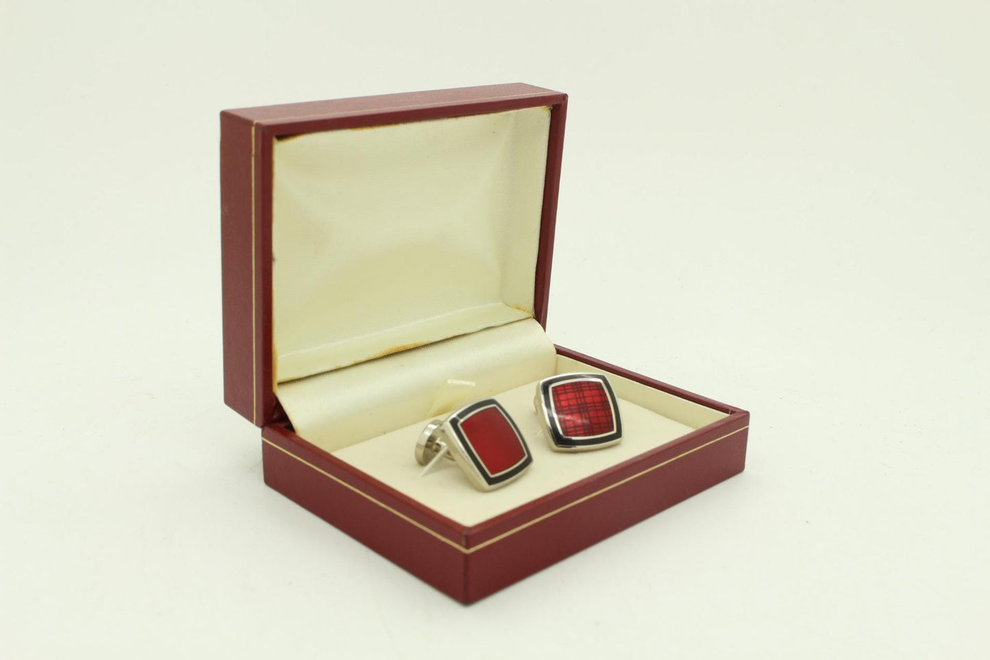 Burberry vintage square cuff links made in England. Solid metal with red enamel. Signature check on one side, plain on the other. NOS