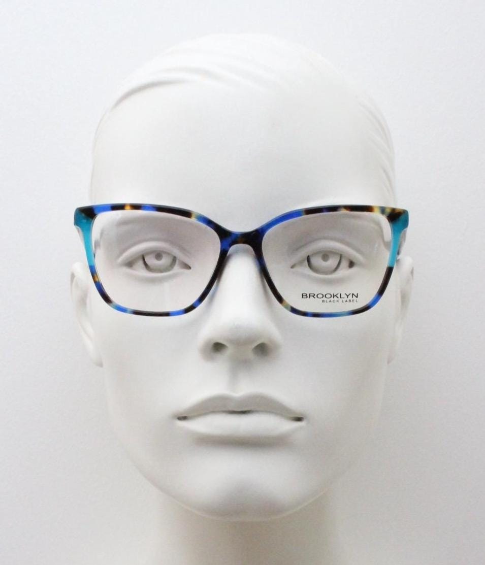 Modified cat eye glasses by Brooklyn. Vibrant blue and brown tones gloss optical frames.  Prescription eyeglasses. RX cateye spectacles