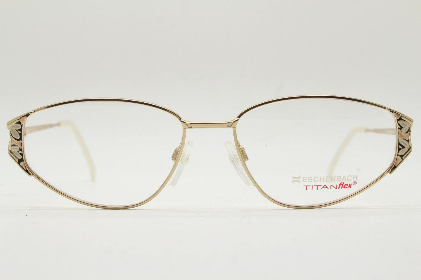 Eschenbach 90s vintage cropped cat eye glasses. Low profile gold metal optical frame with tasteful metallic arm pattern. Prescription. NOS