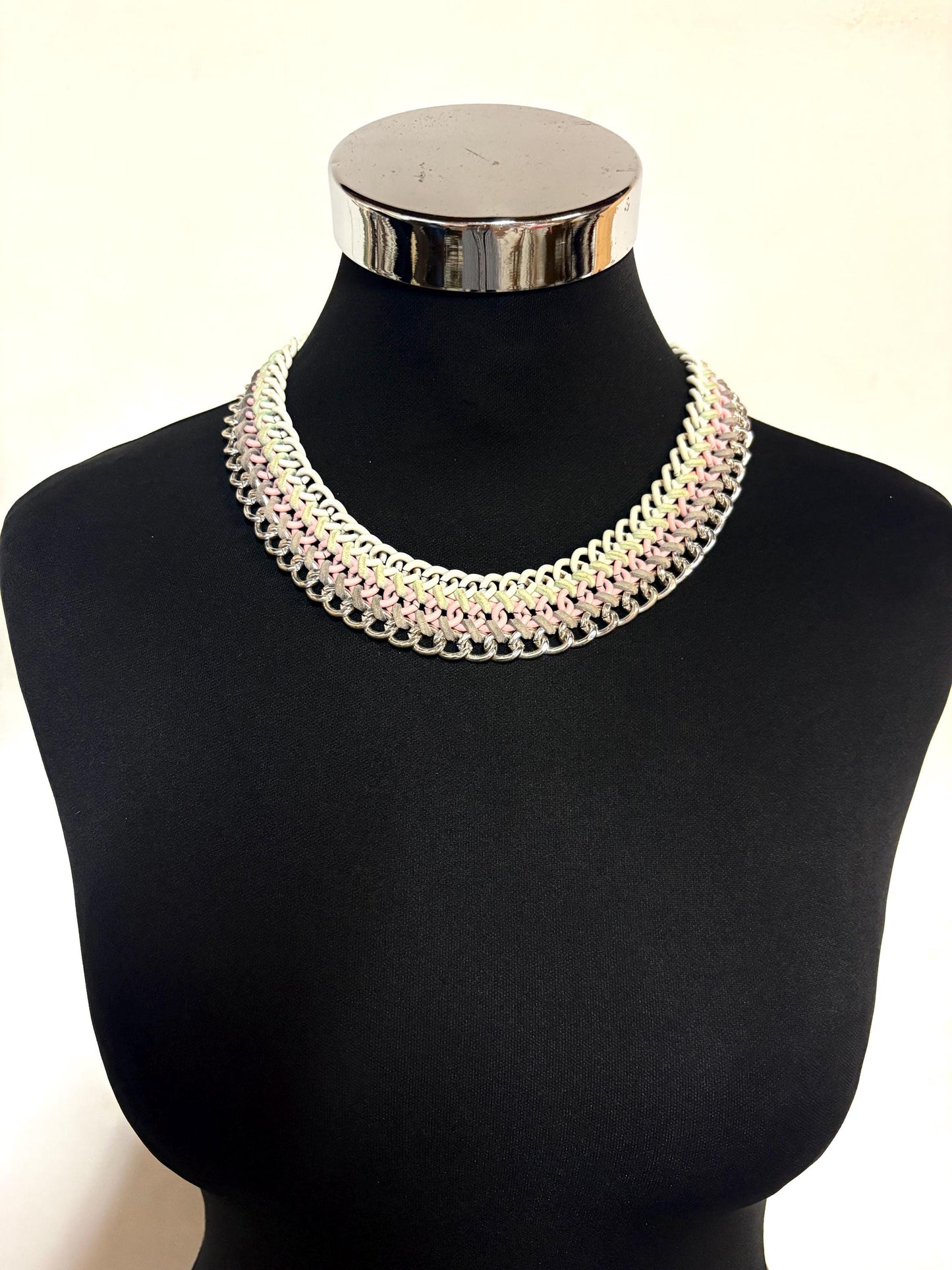 90s vintage 3 tier chain necklace. Solid metal construction in silver, pink, and white tones with grey rubber bonds. Adjustable back