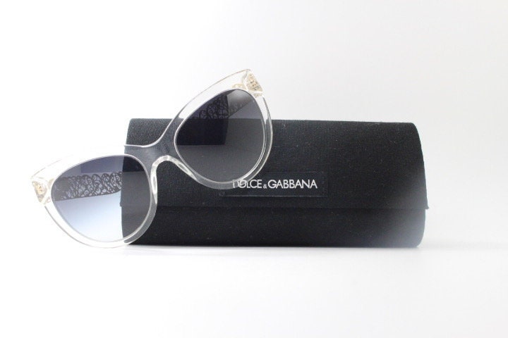 Dolce and Gabbana oversized cateye sunglasses model 4211. Womens transparent cat eye with cut-out florid metal arms and smoky lenses. NOS