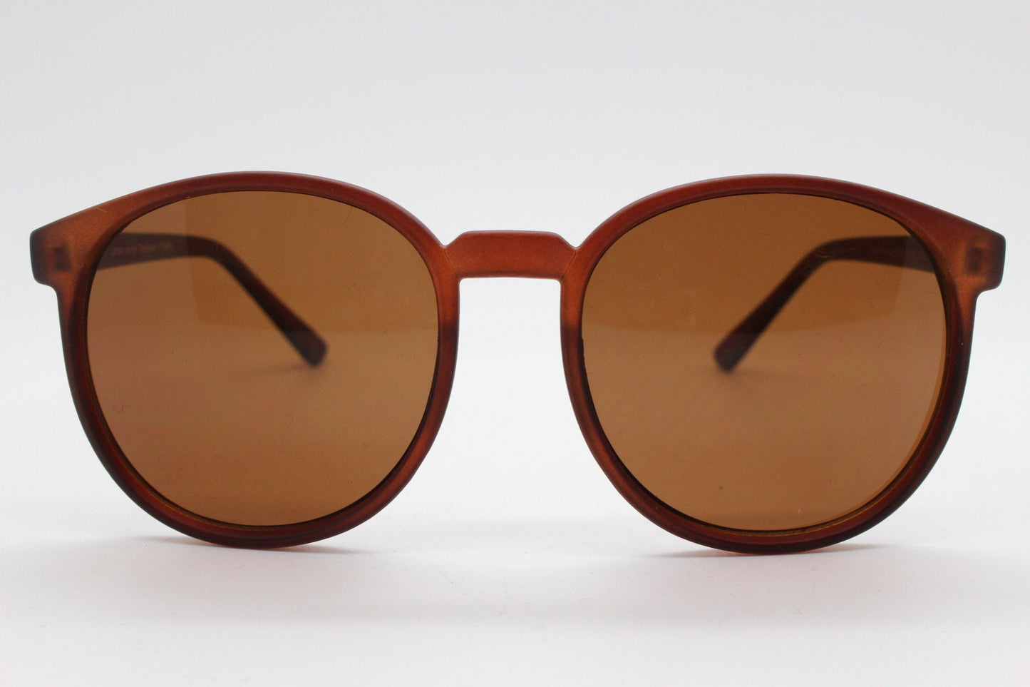 80s vintage round sunglasses. Slightly oversized slim transparent brown frame in a rubber finish with matching lenses. BNWT