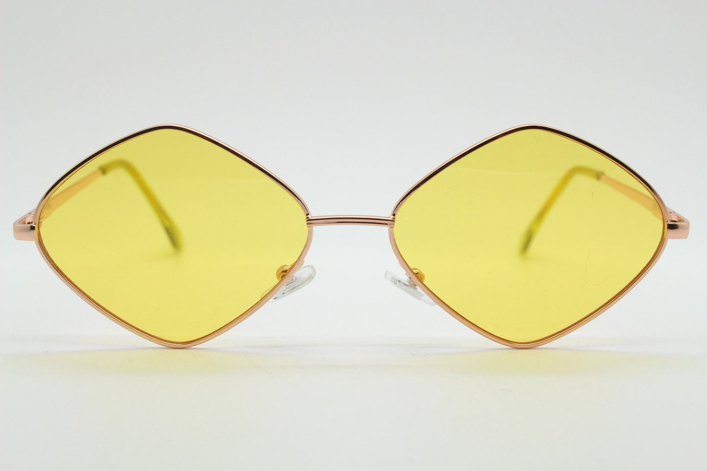 90s vintage diamond sunglasses. Minimal rose gold frame with psychedelic mod style yellow lenses. Unused BNWT