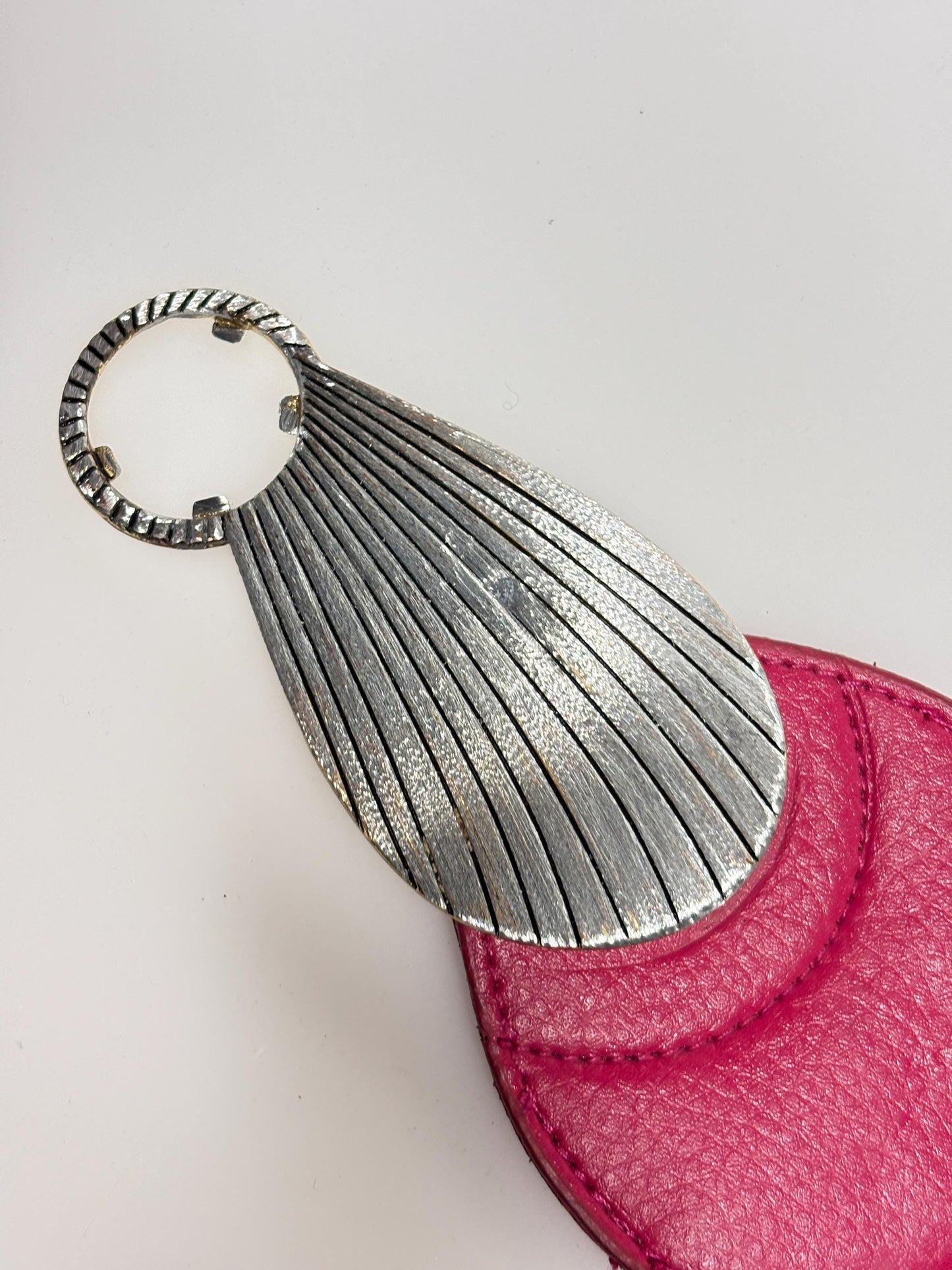 80s vintage womens tall pink elastic belt. Large winged silver and gold buckle. Flattering cinch effect. Adjustable stretchy size range