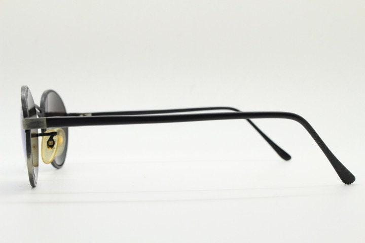 90s vintage oval panto sunglasses. Brushed bronze metal frame with cool blue mirror lenses and black slender arms. Unused NOS