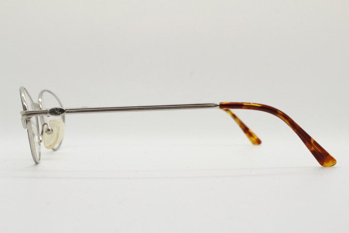 Viennaline 90s vintage oval eye glasses made in italy from titanium. Satin silver optical frame with grey enamel outline. Prescription RX