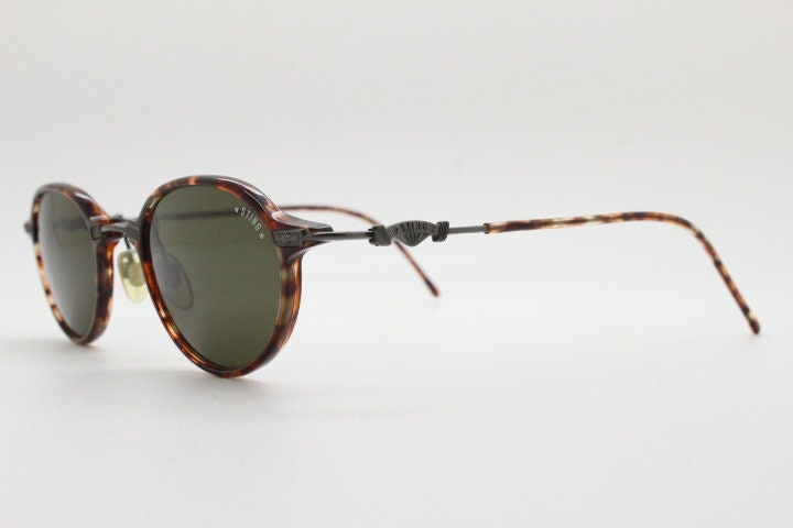 Sting 90s vintage oval sunglasses made in Italy. Refined 'industrial tech' fused with 1930s style in bronze metal and tortoise . Unused NOS