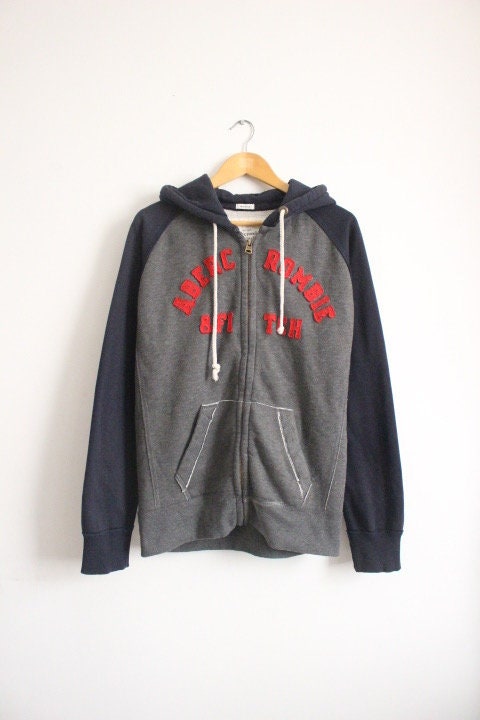 Abercrombie and Fitch grey and blue zipper sweat hoody with large red spell out patch letter chest logo. Mens all cotton medium size