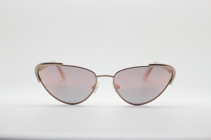 Rebecca Minkoff futuristic golden oval cat eye sunglasses. Women's rose gold metal cateye frame with sunburst mirror lenses. NOS