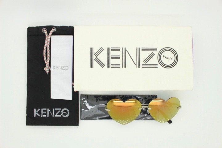 Kenzo mirror heart shaped frameless sunglasses model KZ40005U. Instant classic design with diamantes and big spell out arm logo. NOS