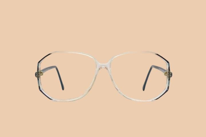 Silhouette 80s vintage hexagon eye glasses made in Austria. Transparent crystal optical frame with abstract blue pattern. Prescription. 70s