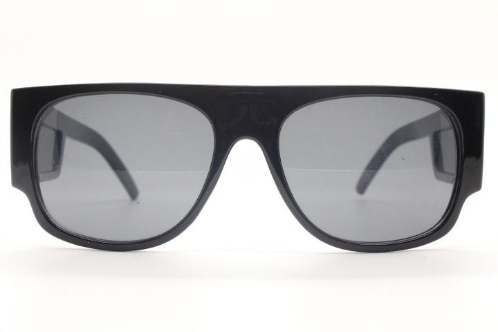 Y2K vintage rectangular side panel sunglasses. Black gloss frame with grey lenses and side window spoilers / blinkers. 2000s NOS goggle