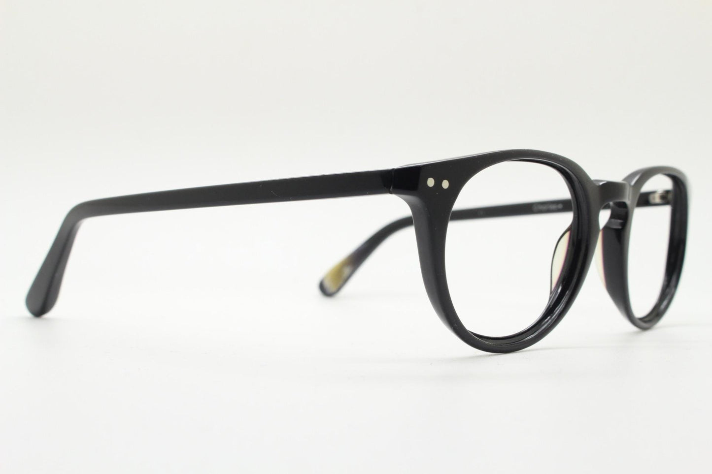 90s vintage oval eye glasses by Alles Brille of Germany. Classical black gloss acetate optical frames with keyhole bridge. RX Spectacles