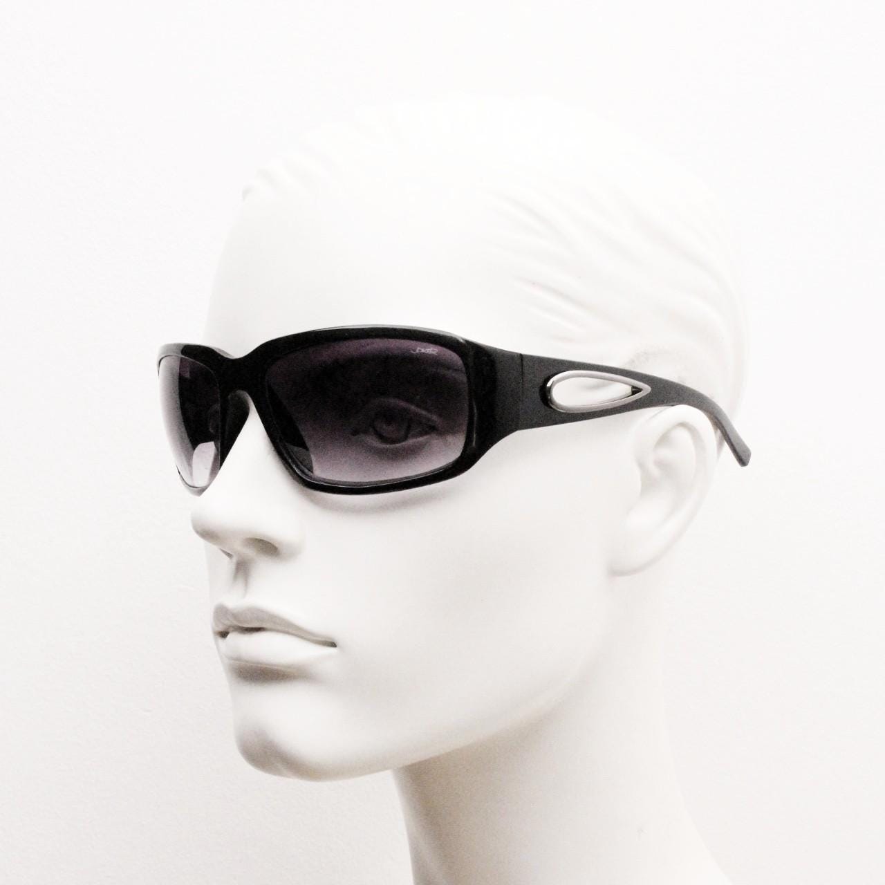 Y2k vintage wrap around bug eye sunglasses. Substantial curved black shield frame with arm holes. Modified 60s biker design. 2000's NOS
