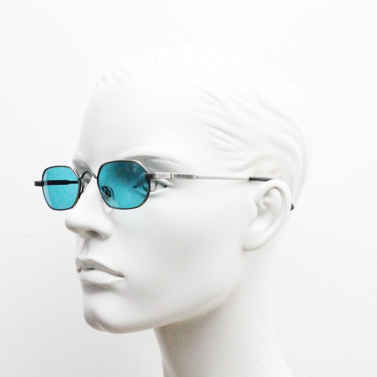 90s vintage small angular oval sunglasses by Blue Point. Low profile brushed bronze finish metal frame with turquoise blue lenses, NOS