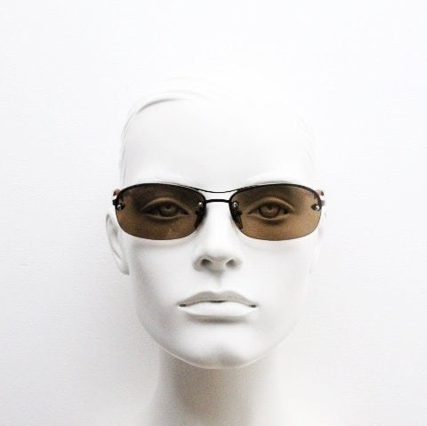 Y2K vintage oval aviator sunglasses. Metallic brown chrome half frame with mid tone curved bug eye lenses and straight arms. 2000's. NOS