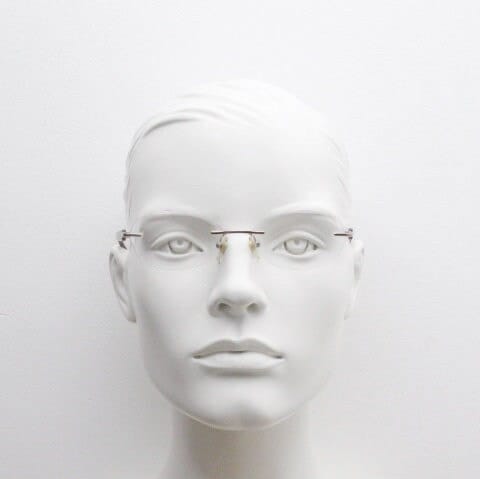 Vogue vintage frameless oval eye glasses. Transparent acetate arms with purple and green tones. Minimal Prescription RX Optical frame